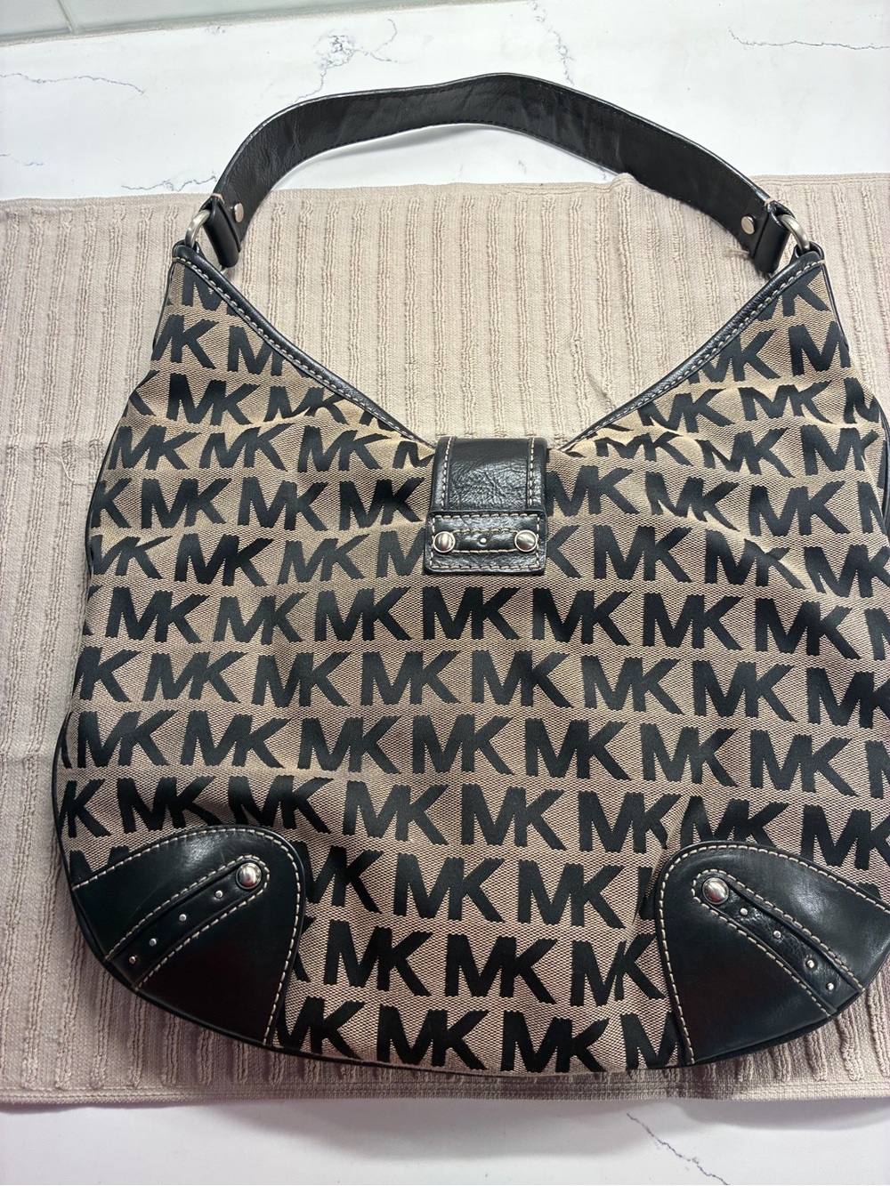 Michael Kors Black MK Logo Hobo with Tan Background